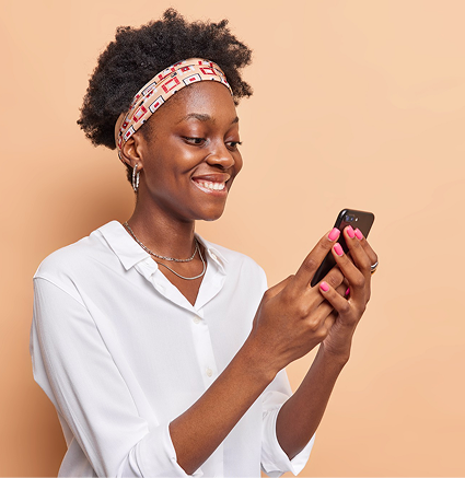 Smiling woman using phone
